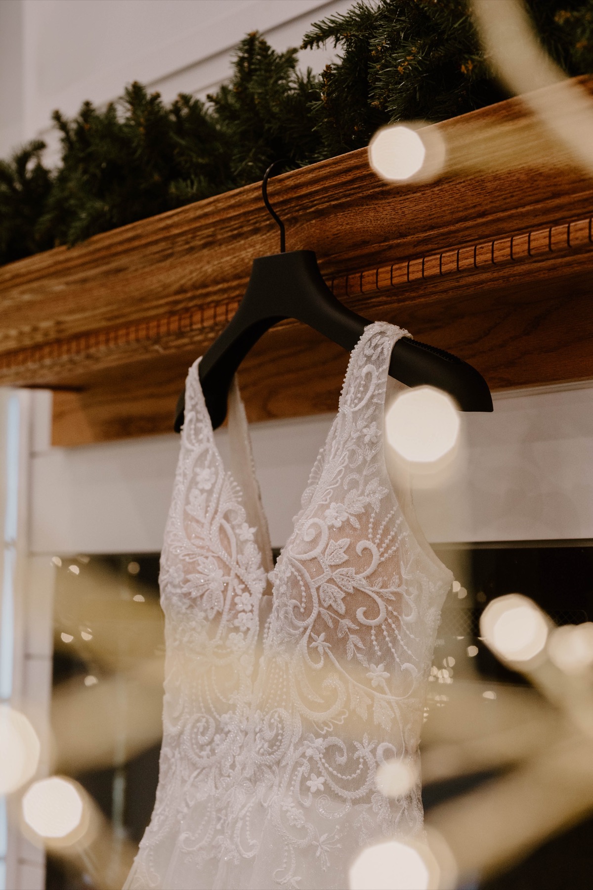 Lace wedding dress detail with soft bokeh lights